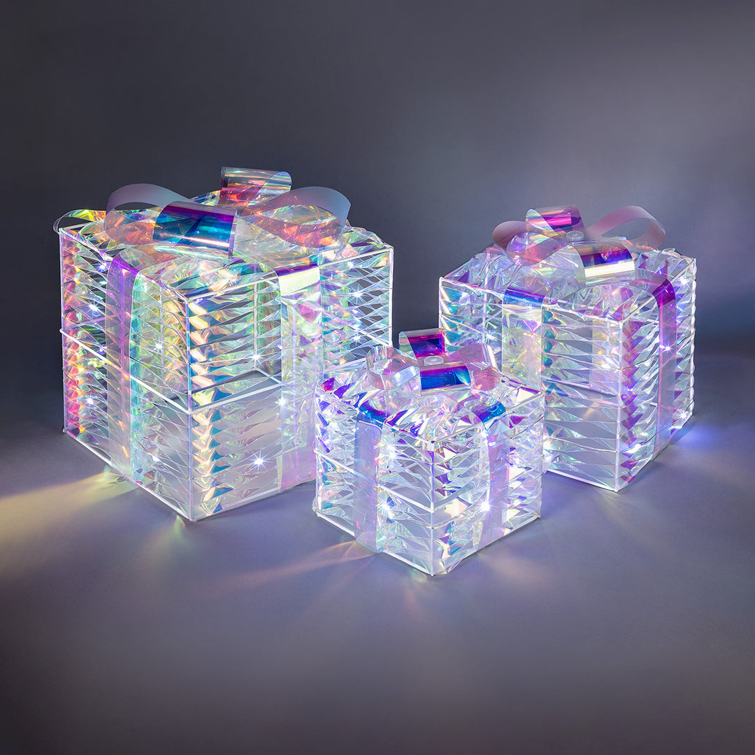 Set of three Christow Light Up Iridescent Christmas Presents with glowing LEDs and a rainbow-like finish