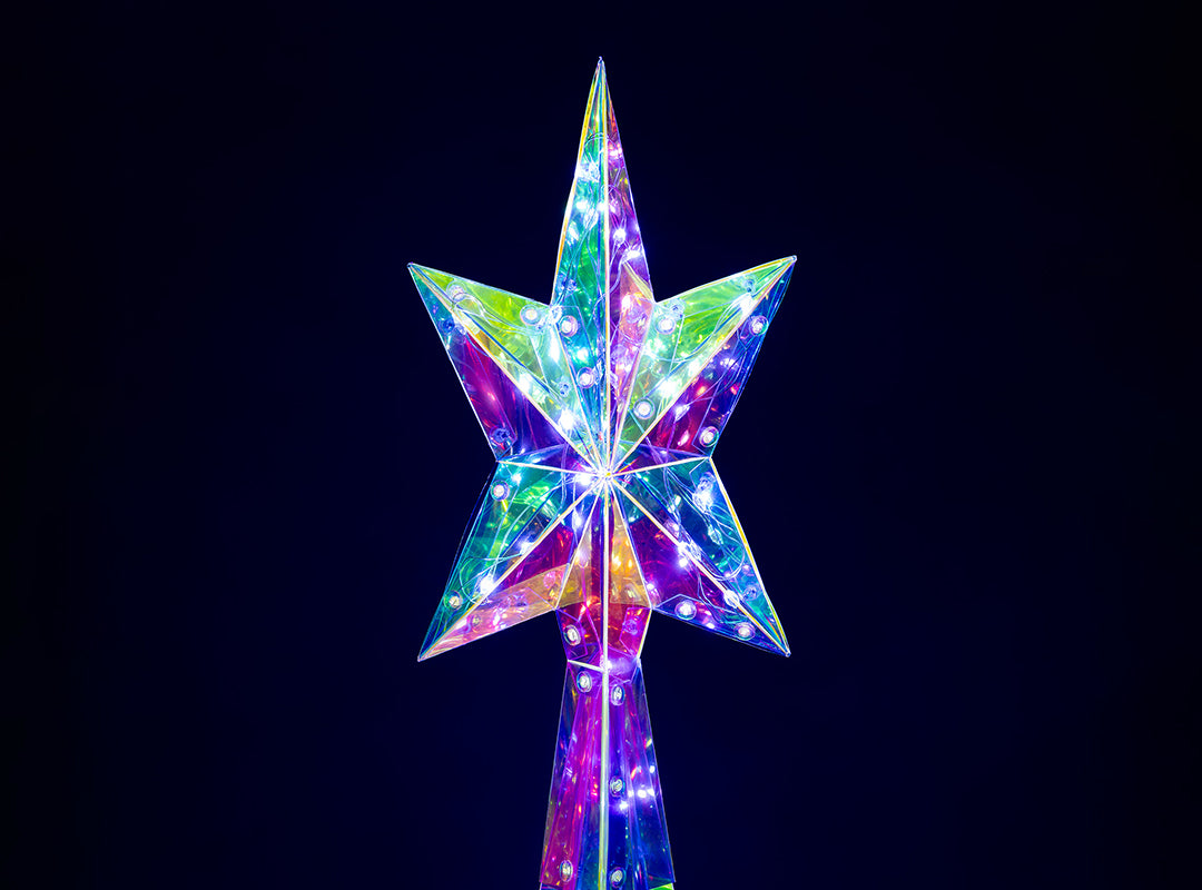Close-up of the illuminated star topper on the Christow Large Iridescent Christmas Tree showing the iridescent panels and white LEDs