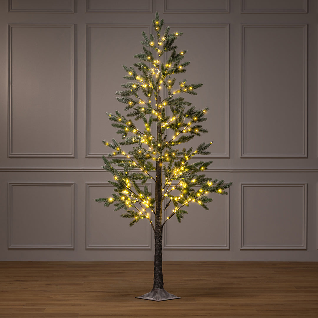 Full view of the Christow Pre-Lit Halden Fir Flocked Artificial Christmas Tree illuminated with warm white micro LEDs