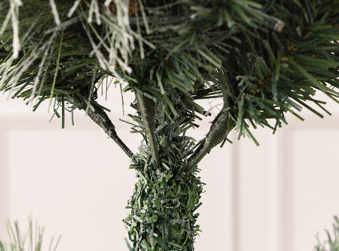 Close-up of the hinged branches and central trunk on the Christow Valmorel Flocked Artificial Christmas Tree