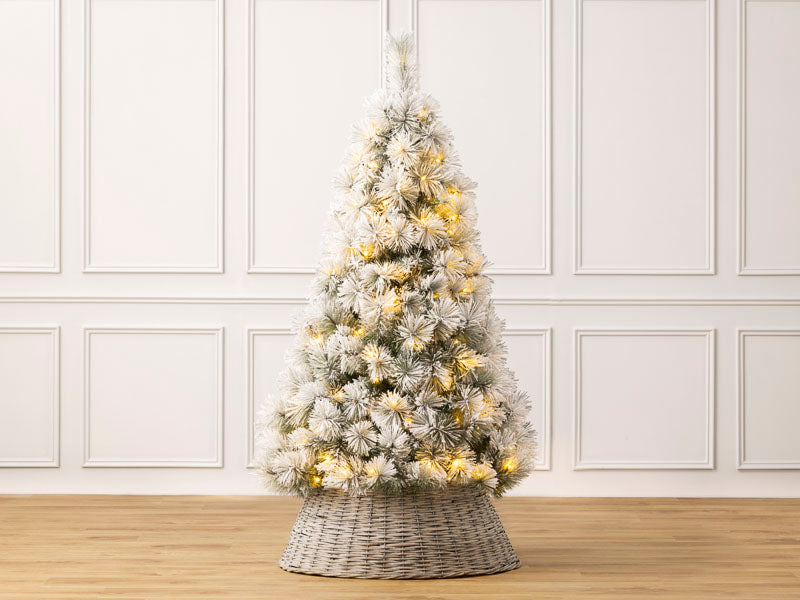 Christow Pre-Lit Valmorel Flocked Artificial Christmas Tree illuminated with warm white LEDs