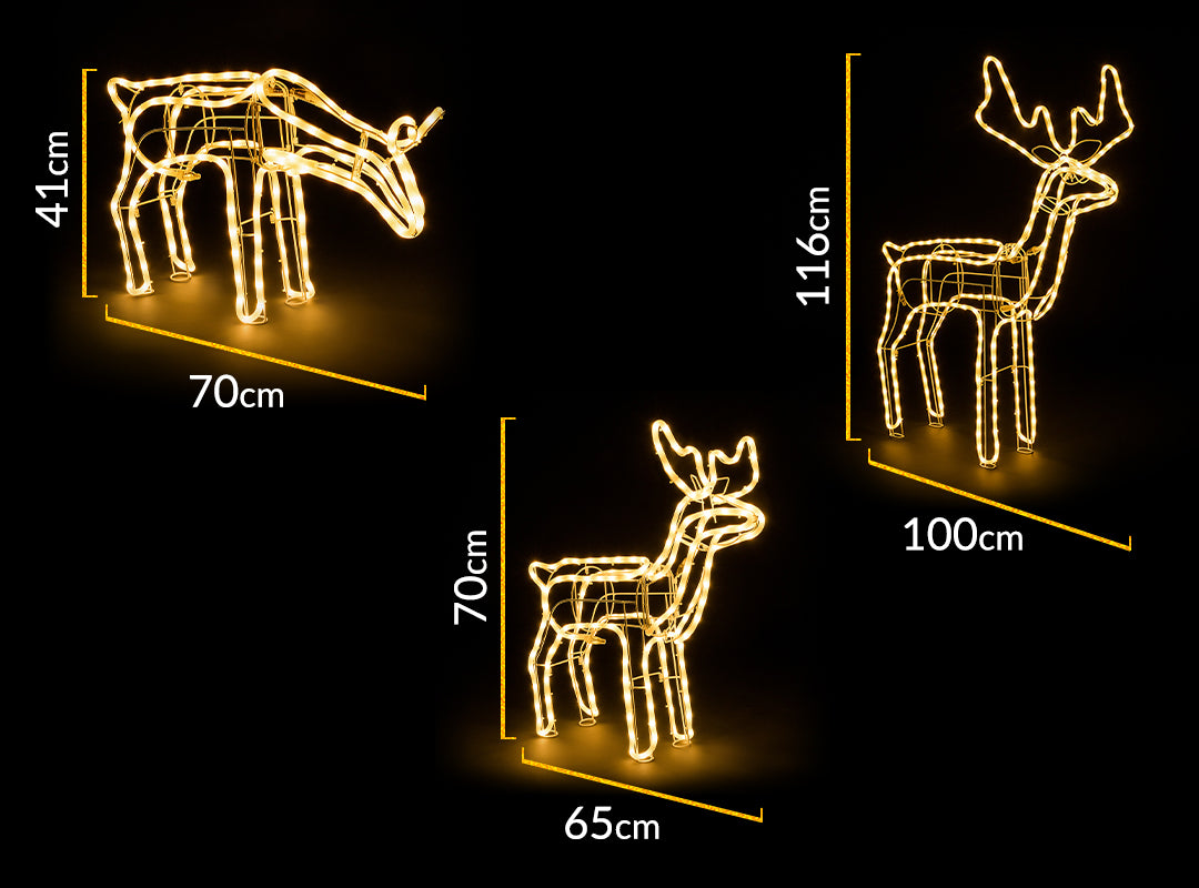 Christow Warm White LED Reindeer dimensions – large stag 100cm wide x 116cm tall, small fawn 65cm wide x 70cm tall, grazing reindeer 70cm wide x 41cm tall, shown glowing against a black background