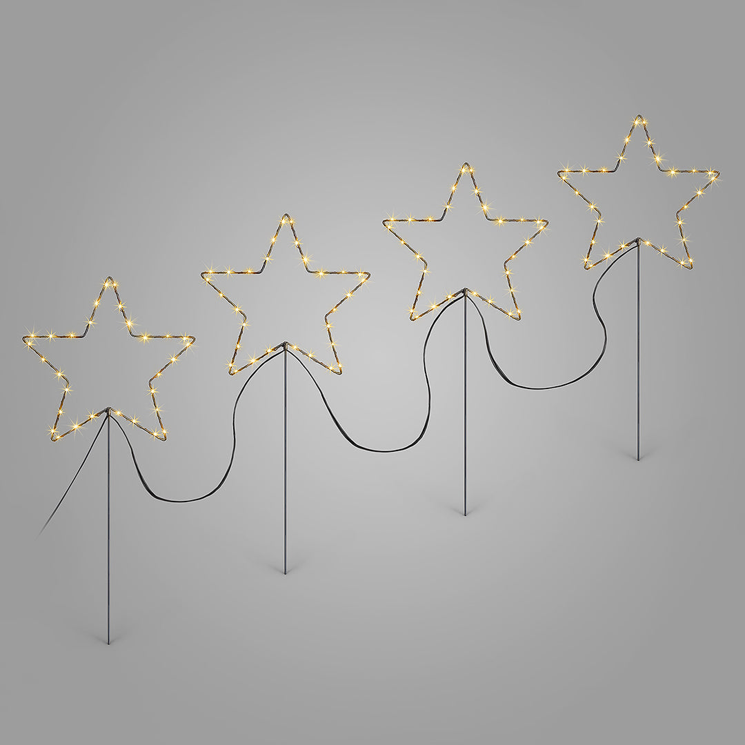 Set of four Christow Micro LED Star Path Lights illuminated by warm white LEDs