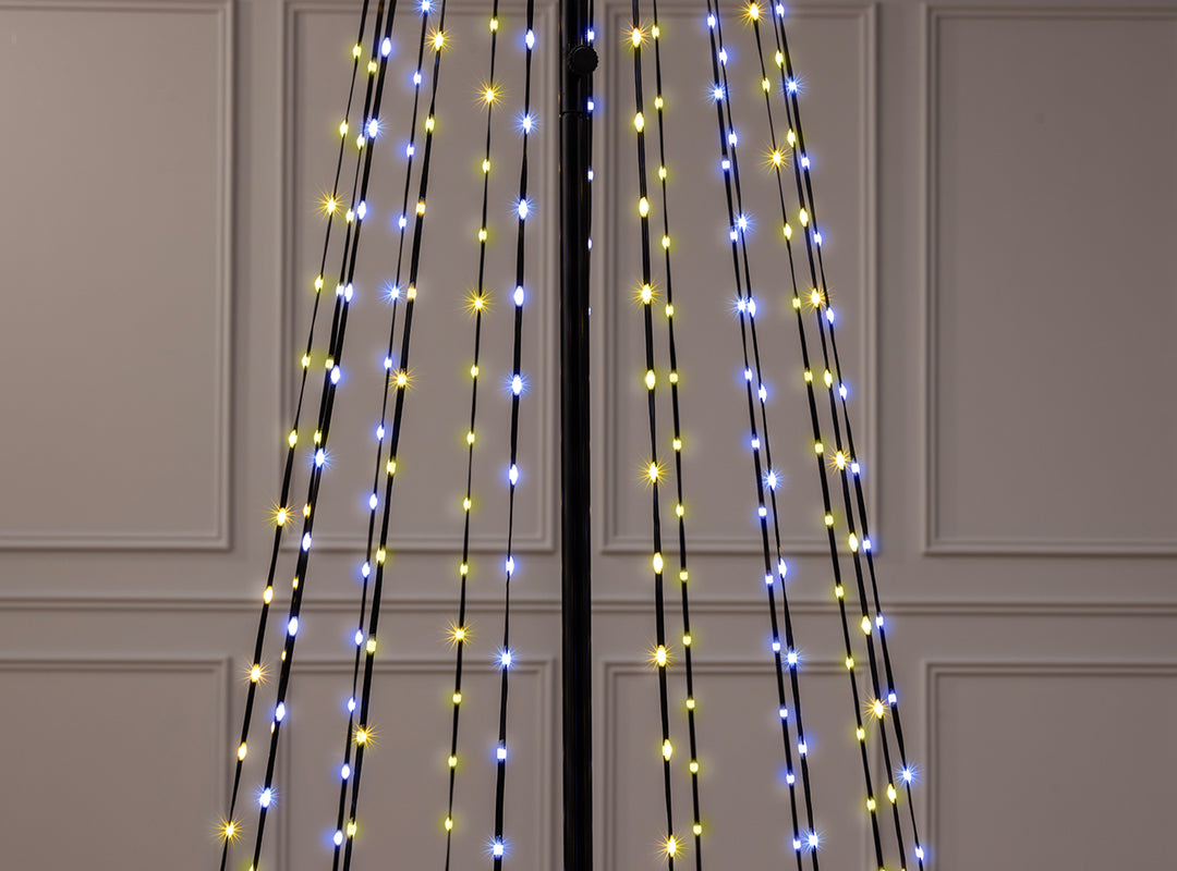 Close-up of warm white and cool white LED lights on the wires of the Christow Snowfall Maypole Christmas Tree