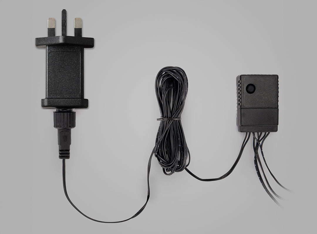 UK plug power adapter, extension cable and multi-function controller unit included with the Christow Snowfall LED Maypole Christmas Tree