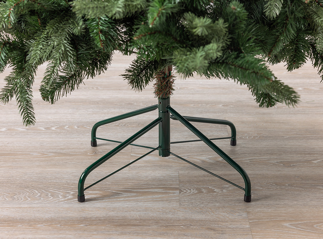 Sturdy green metal stand with rubber feet on the Christow Fraser Fir Artificial Christmas Tree