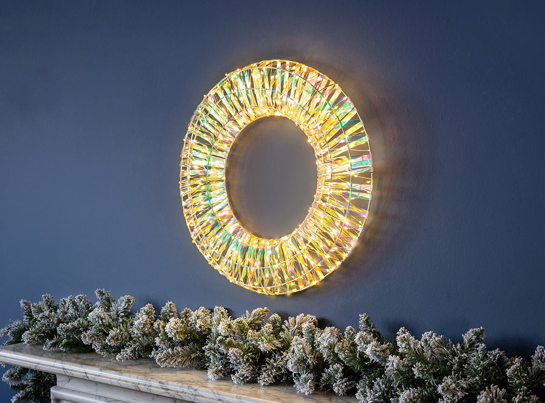 Illuminated Christow Iridescent Warm White LED Christmas Wreath shimmering with rainbow-like colours