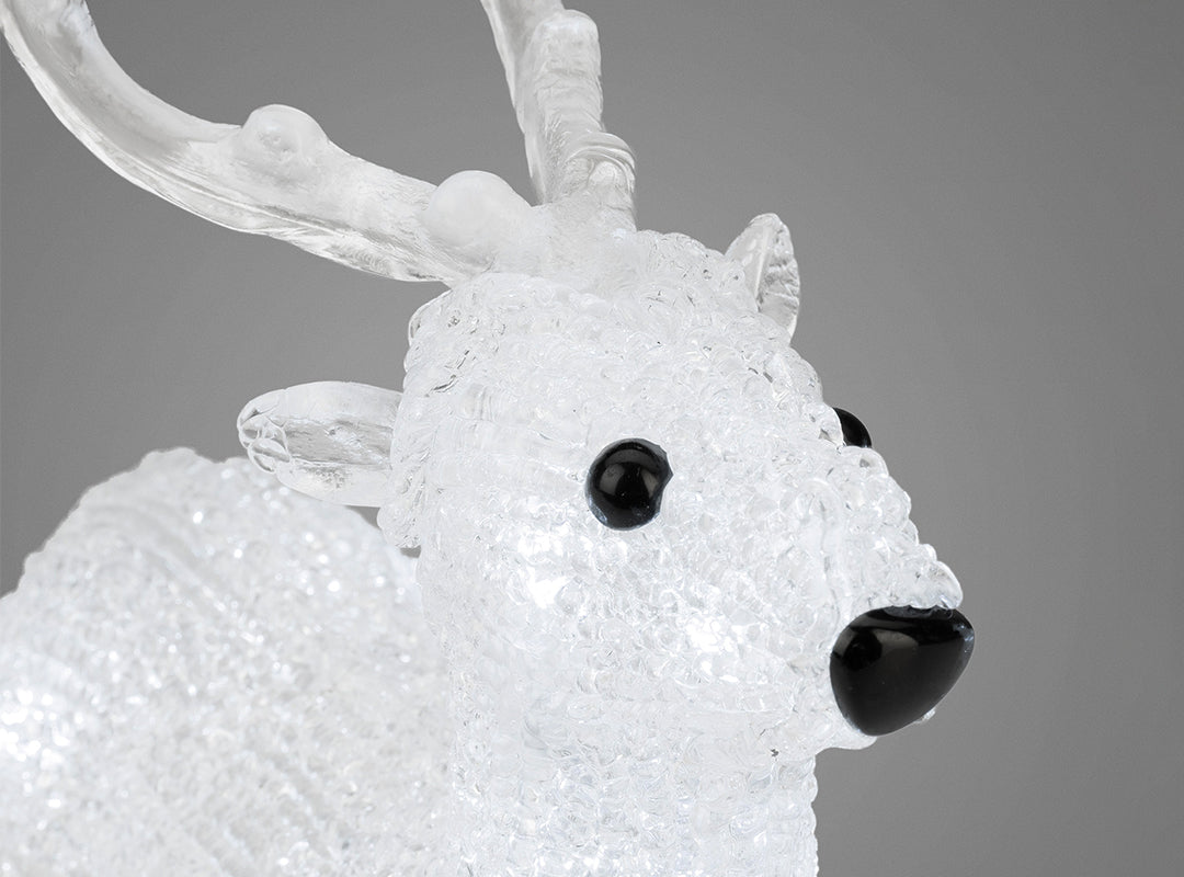 Close-up of a clear acrylic reindeer illuminated by white LEDs from the Christow Set of 5 LED Acrylic Reindeer Lights