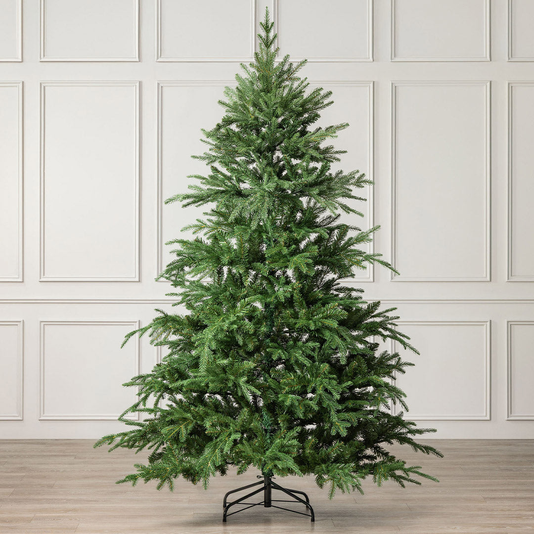 Christow Nordmann Fir Artificial Christmas Tree with naturally uneven, layered branches and a classic tapered shape