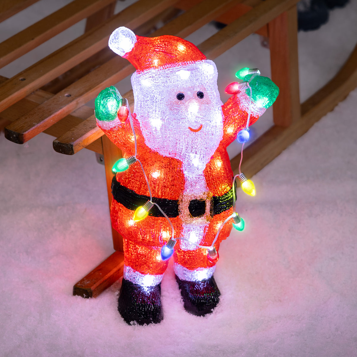 Christow Light Up Santa with String Lights Christmas Decoration displayed beside a wooden sledge